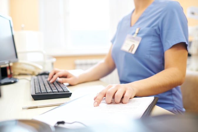 healthcare_worker_reviewing_ehr