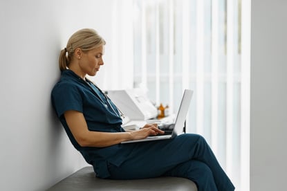 healthcare-worker-using-electronic-health-records-laptop