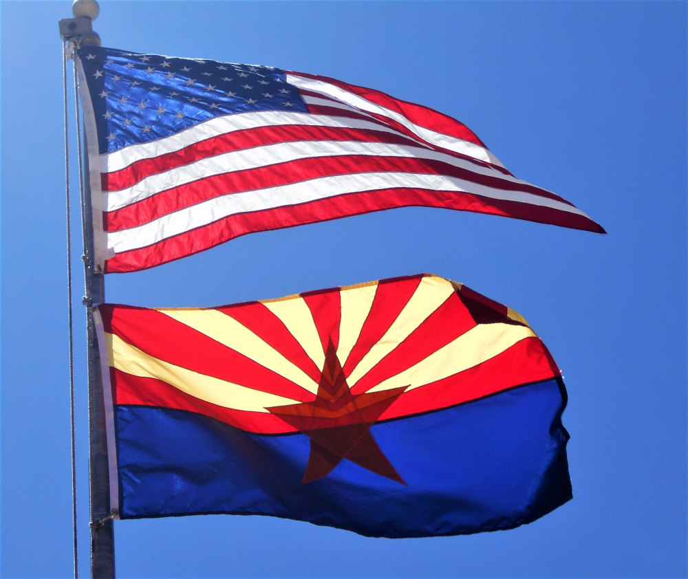 https://8340896.fs1.hubspotusercontent-na1.net/hubfs/8340896/Resource%20-%20Podcast%20%20-%20Imagery/arizona_flag_american_flag_workers_compensation_law.jpg